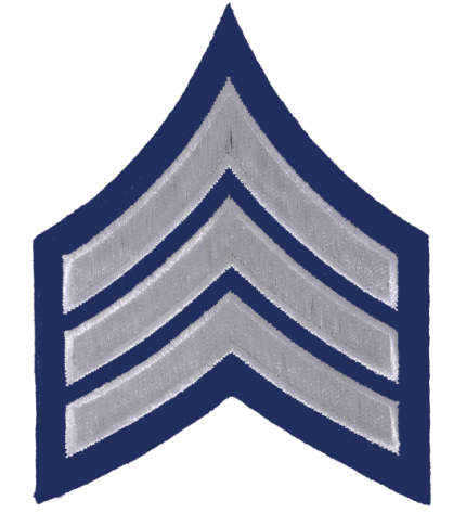 The Chevron For A Sergeant Is Silver In Color With A Navy Blue Background